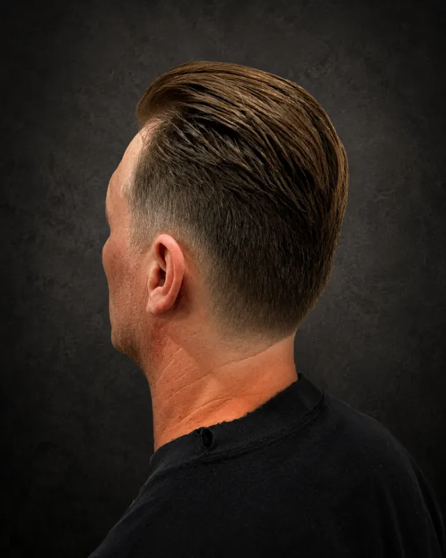 Client with a taper back haircut by Tami Lee